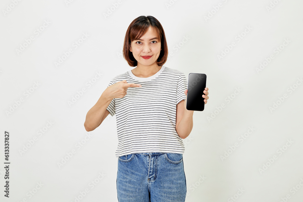 Satisfied smiling asian young woman recommending mobile phone app, website company on a smartphone, showing screen on white background. Satisfied smiling asian young woman recommending mobile phone app, website company on a smartphone, showing screen on white background.