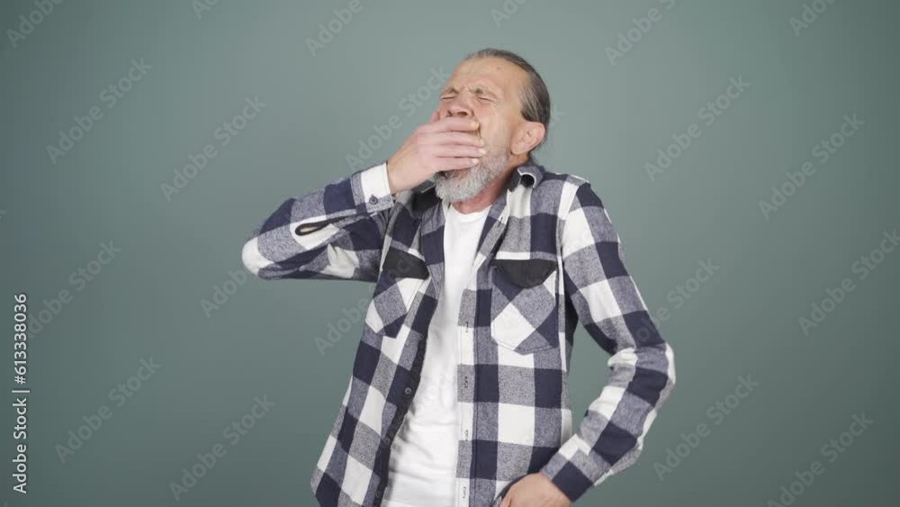 Sleepy man yawns. Sleepy man yawns.