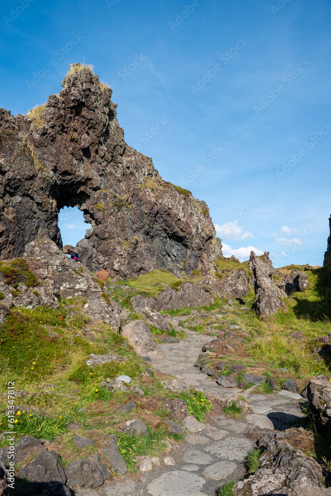 Fototapeta premium Stone path at Djúpalónssandur black sand beach on a sunny day, Iceland