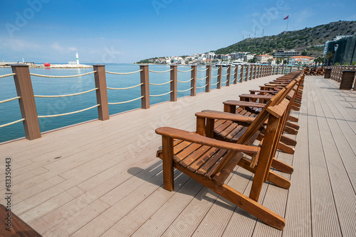 Terrace with a view on sea and sunset. Lounge chair in a sunlight.