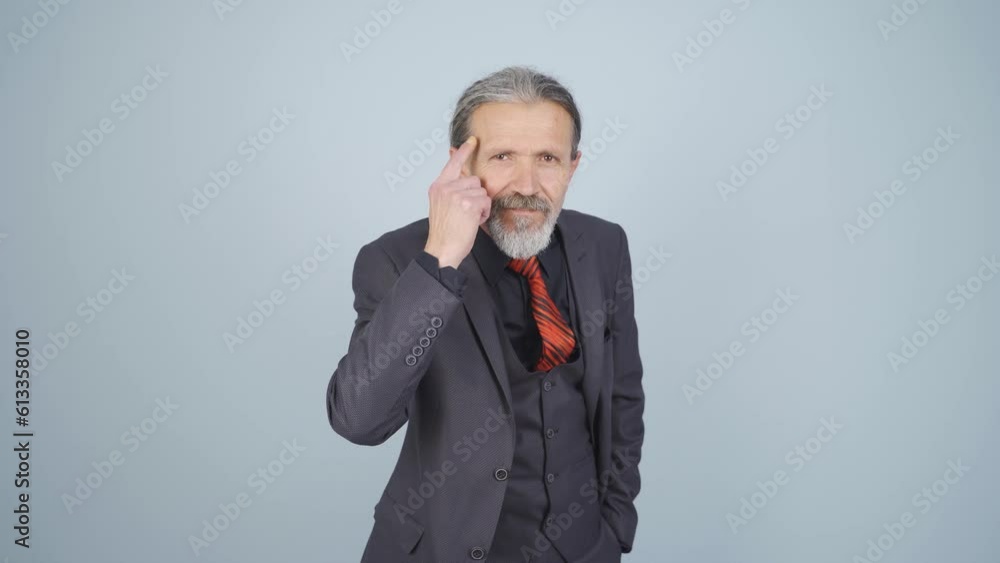 Businessman showing his mind looking at camera. Businessman showing his mind looking at camera.
