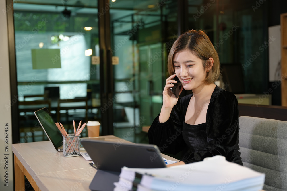 Asian business woman woman working on documents, new project. Asian business woman woman working on documents, new project.