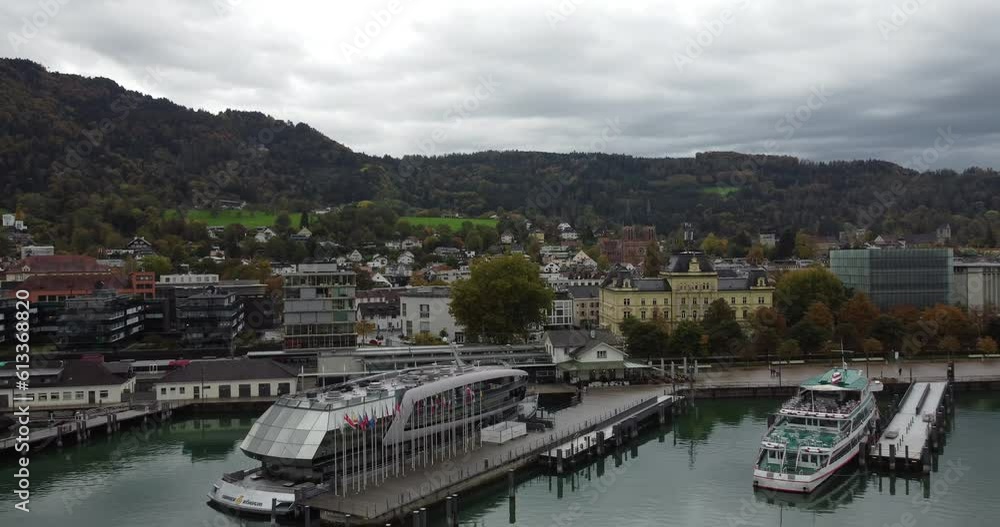 Aerial view of historic Bregenz, you can see the ferry in the port on a cloudy happy autumn day, in the background the hills with forests full of tranquility, Vorarlberg, Austria, Europe Aerial view of historic Bregenz, you can see the ferry in the port on a cloudy happy autumn day, in the background the hills with forests full of tranquility, Vorarlberg, Austria, Europe