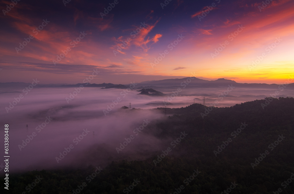 Beautiful scenery at sunrise with fog from the top of Doi Pha Phueng, Ban Pang Puai, Mae Moh, Lampang Province, Thailand.