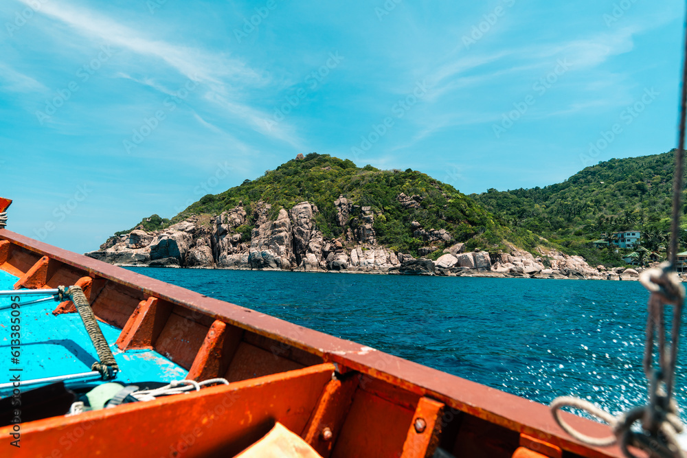  traveling on a long-tail boat on the bay at Koh Tao