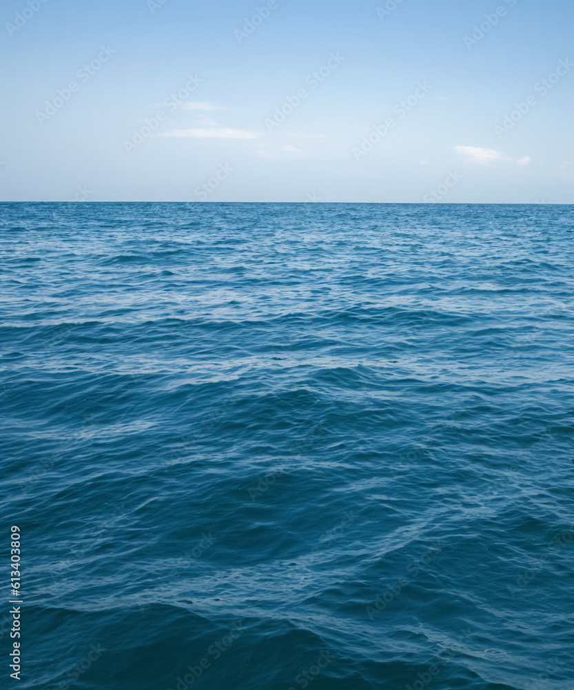 view of blue calm sea and blue clear sky in the summer. generative AI