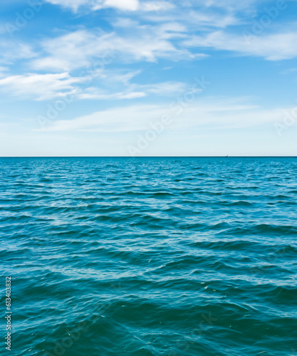 view of blue calm sea and blue clear sky in the summer. generative AI © squallice