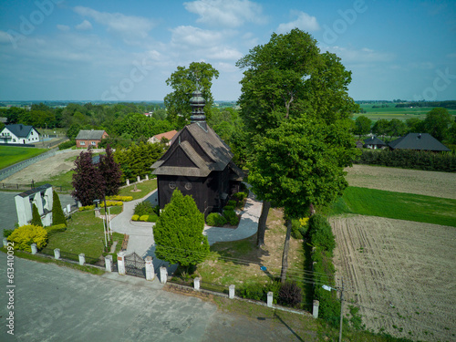 Fototapeta Naklejka Na Ścianę i Meble -  A wooden, historic church in the village of Suchcice, Poland.