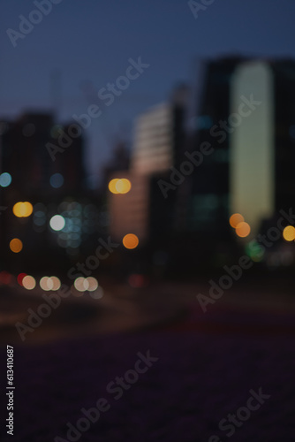 Defocused image of traffic  buildings  and the skyline in Dubai at sunset.