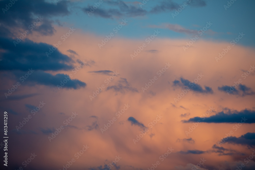 Rain clouds at sunset as background