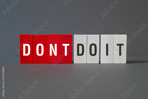 Dont do it - word concept on building blocks, text photo