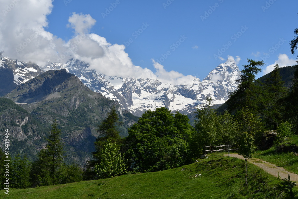 Alpine landscape with a view of the Matterhorn mountain, going up to Chamois.