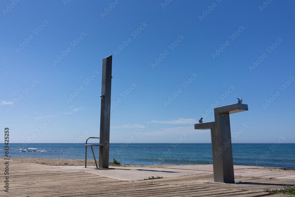 beach shower by the sea in summer beach shower by the sea in summer