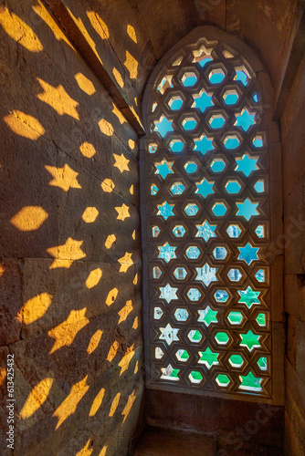 Qutb Minar, Delhi, carvings in the sandstone of a window gives a pattern of sky with stars