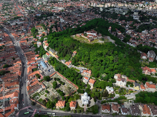 Aerial view of the Citadel of the Guard, a small fortress perched atop a hill in Brasov, Romania, Constructed in the 16th century, the citadel once served as a key defense structure for the city.