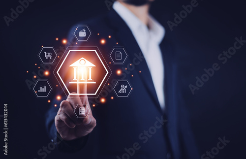 Businessman touching on digital online banking and icon network connection, online payments, shopping and digital technology business on virtual screen dark blue background.