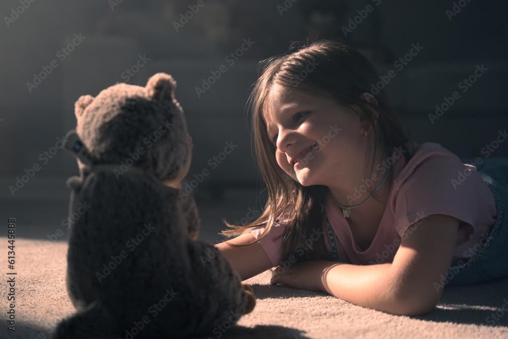 Closeup of happy little girl playing with teddy bear Closeup of happy little girl playing with teddy bear