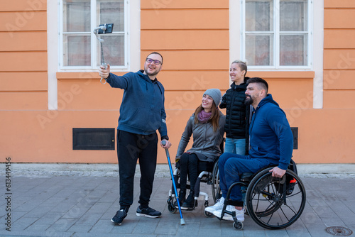 Four friends with disabilities taking selfie © Marko Rupena