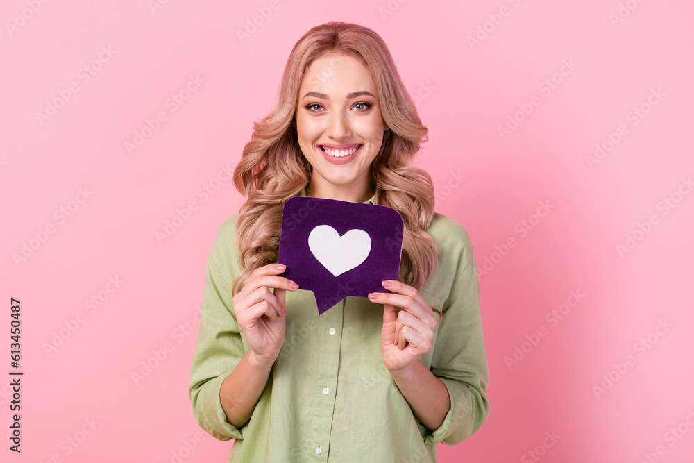 Photo of pretty cheerful woman dressed green shirt rising heart feedback card isolated pink color background Photo of pretty cheerful woman dressed green shirt rising heart feedback card isolated pink color background