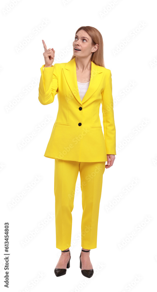 Beautiful business woman pointing at something on white background Beautiful business woman pointing at something on white background