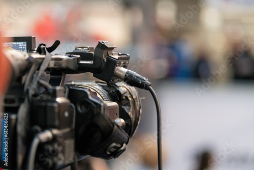 Tech industry in action as a camera captures insightful moments at a technology trade show, showcasing innovation, knowledge, and the power of technology