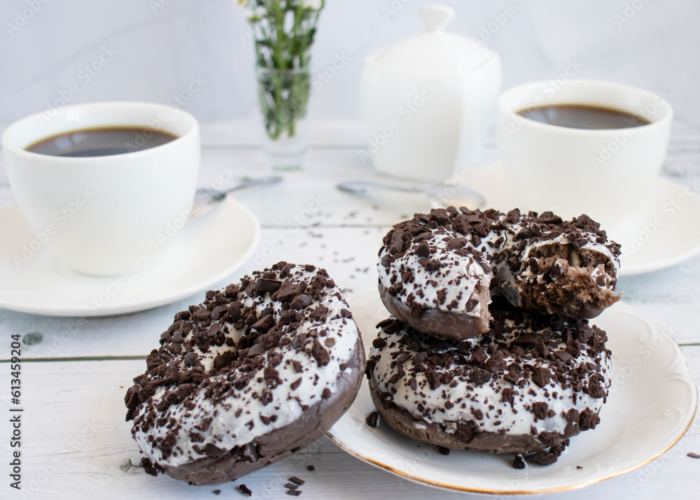Chocolate donuts with cup of coffee. on white wooden table. Chocolate donuts with cup of coffee. on white wooden table.
