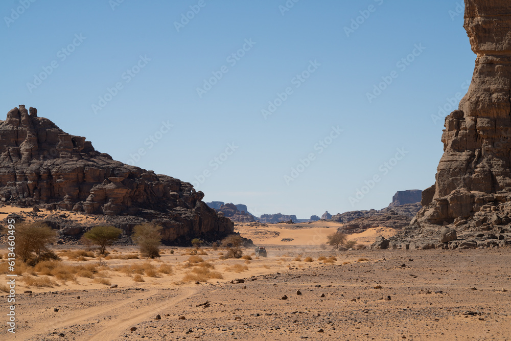 view in the Sahara desert of Tadrart rouge tassili najer in Djanet City ,Algeria.colorful orange sand, rocky mountains view in the Sahara desert of Tadrart rouge tassili najer in Djanet City ,Algeria.colorful orange sand, rocky mountains