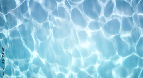 Beautiful background image in form of texture water surface, beautiful light reflections glare in light blue colors.