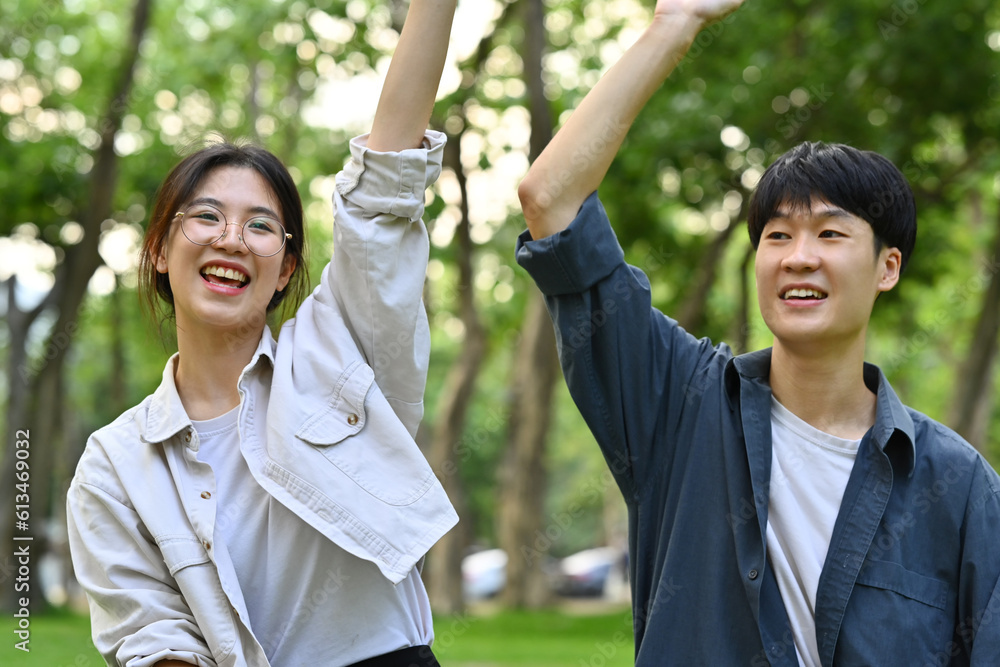 Happy female and male classmates having fun celebrating and laughing. Friendship, community, youth and university concept Happy female and male classmates having fun celebrating and laughing. Friendship, community, youth and university concept