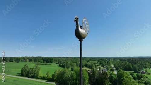 There is no cross at the top of the church of Vastseliina, only a rooster, Estonia. photo