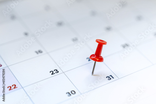 Red push pin on calendar 31st day of the month, new year eve