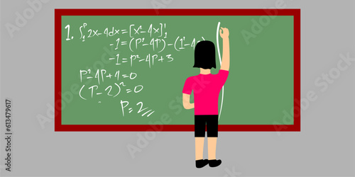 student writing on the blackboard in the classroom 