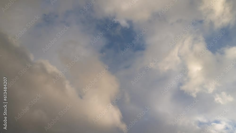 Cumulus clouds of golden color expand across the sky at sunset
Cumulus clouds of golden color expand across the sky at sunset