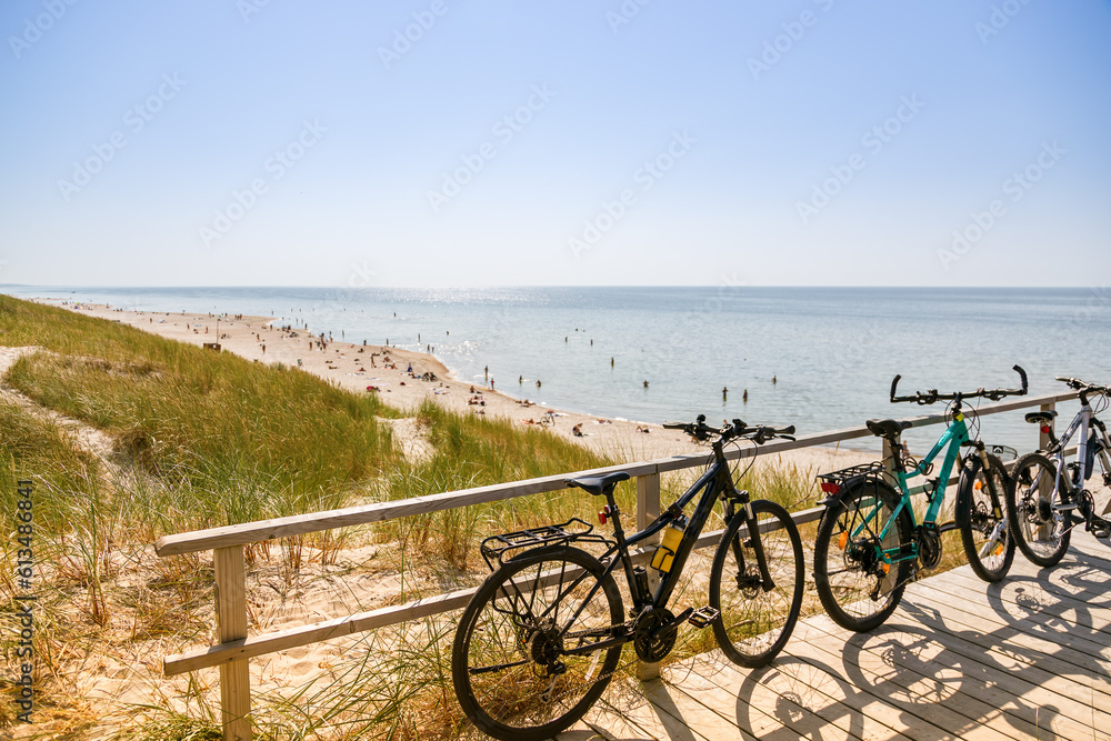 Three bicycles parked near the beach. Summer activity and summer journey concept. Three bicycles parked near the beach. Summer activity and summer journey concept.