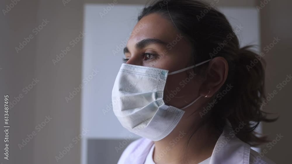 medium slowmo of worried upset exhausted female doctor or nurse feels depressed after hard shift. High quality FullHD footage medium slowmo of worried upset exhausted female doctor or nurse feels depressed after hard shift. High quality FullHD footage