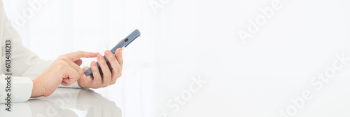 point finger on screen mobile phone close up, person texting text message, officer touch screen on smartphone bright light office, online internet.Wide horizontal Panorama cover header web Banner.