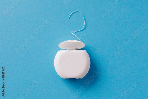 Принти на полотні Dental floss for cleaning teeth on blue