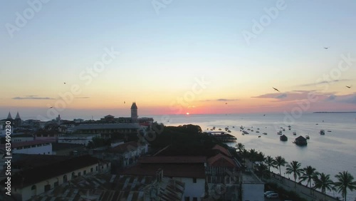 Drone stock footage of Zanzibar Island, sunset over the shoreline photo