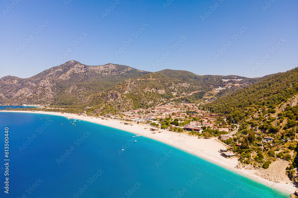 Aerial wide shot of Oludeniz resort village on Aegean sea coast in Turkey, with copy space