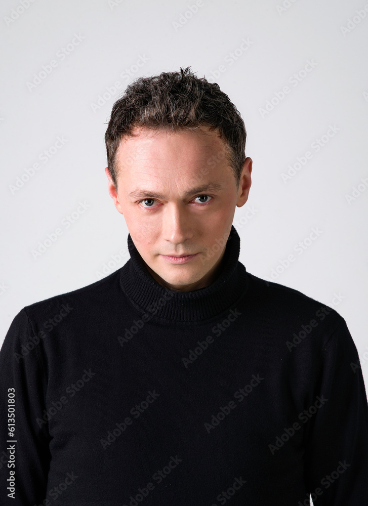 handsome emotional funny men in black sweater on white background handsome emotional funny men in black sweater on white background