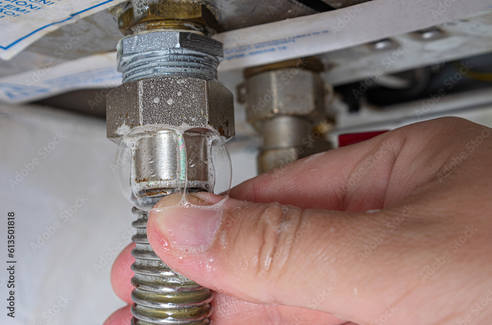 Foto de Gas leak at home boiler room. Inflating bubbles of soap mixture