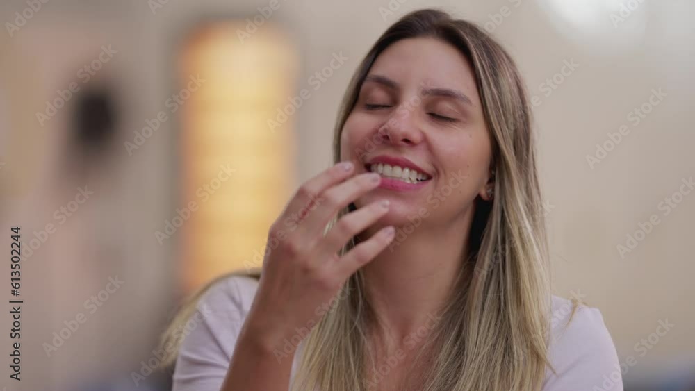 Happy woman spontaneous laugh and smile. Authentic real life person laughing at funny reaction Happy woman spontaneous laugh and smile. Authentic real life person laughing at funny reaction
