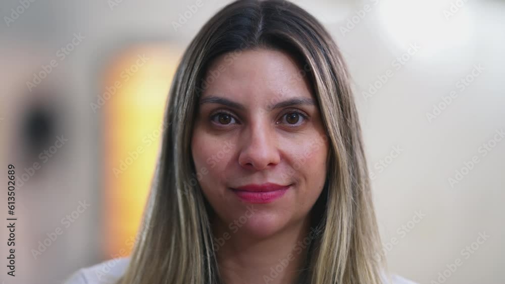 Close-up face of a happy woman smiling at camera. Portrait of a caucasian person in 30s Close-up face of a happy woman smiling at camera. Portrait of a caucasian person in 30s
