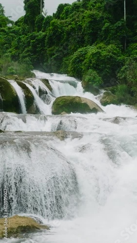 Stunning close up view of Aliwagwag Falls. Davao Oriental, Philippines. Mindanao. Slow Motion. Vertical. photo