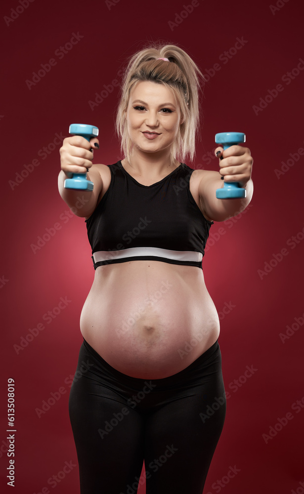 Pregnant woman doing fitness Pregnant woman doing fitness