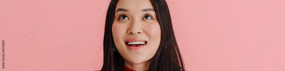 Asian young woman smiling and using mobile phone Asian young woman smiling and using mobile phone