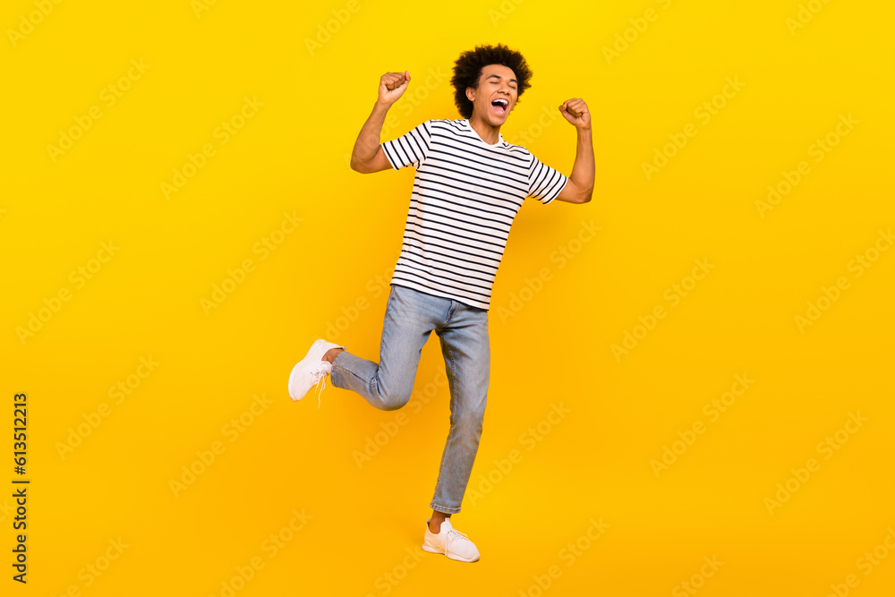 Full body photo of winner crazy victory yelling guy fists up hooray celebrate support football club fan isolated on yellow color background