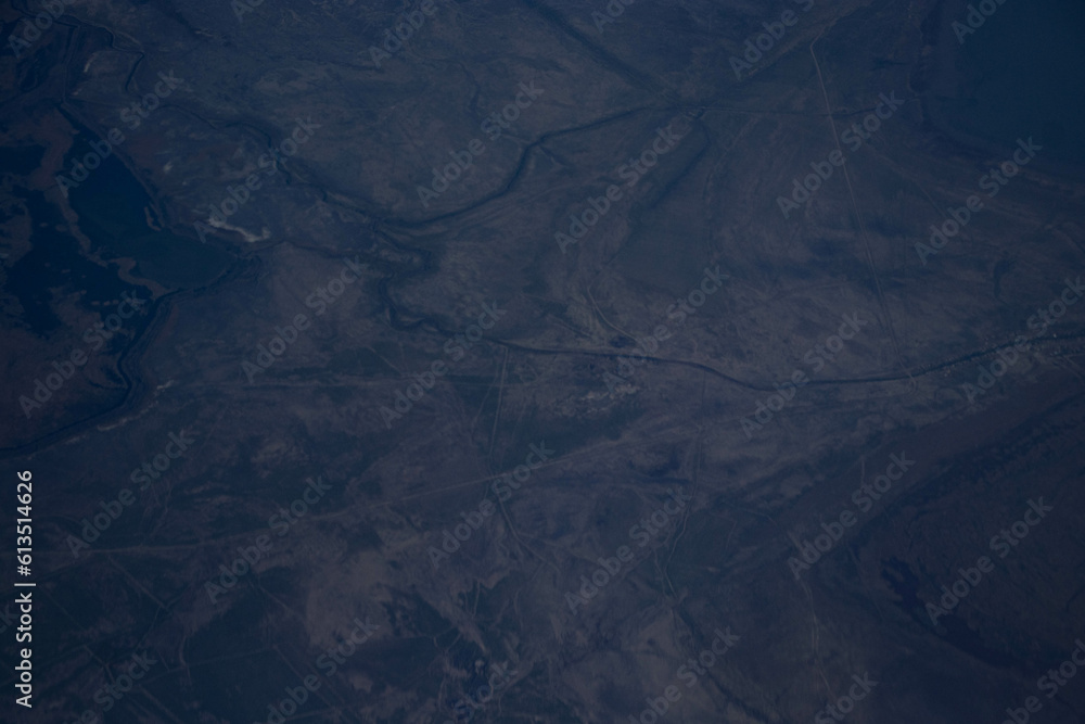 A view of the mountains from the height of an airplane. Beautiful scenery of nature, the beauty of the mountains. A view of the mountains from the height of an airplane. Beautiful scenery of nature, the beauty of the mountains.
