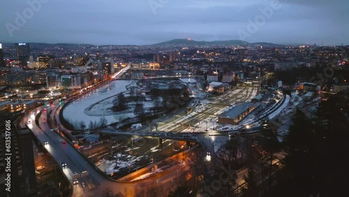 Aerial view of Oslo Downtown Skyline, Norway. Financial district and business centers in smart urban city in Europe. Skyscraper and high-rise buildings at night.