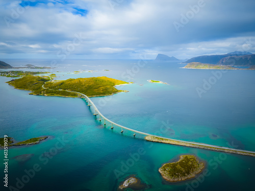 Norwegian sea aerial view over Sommarøy arctic beach, Norway. 
Day in Sommarøy, looking towards Kvaløya, Tromsø. Bridge connects group of islands.